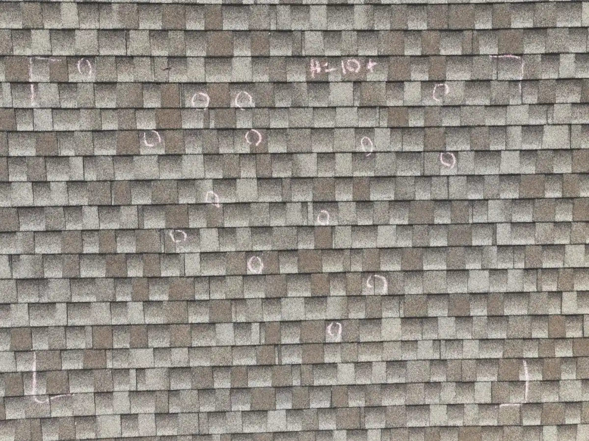 Hail damage test square showing storm impact on Colorado roof by Gates Enterprises